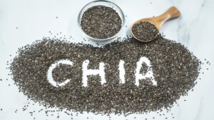 Chia seeds on table and in a bowl